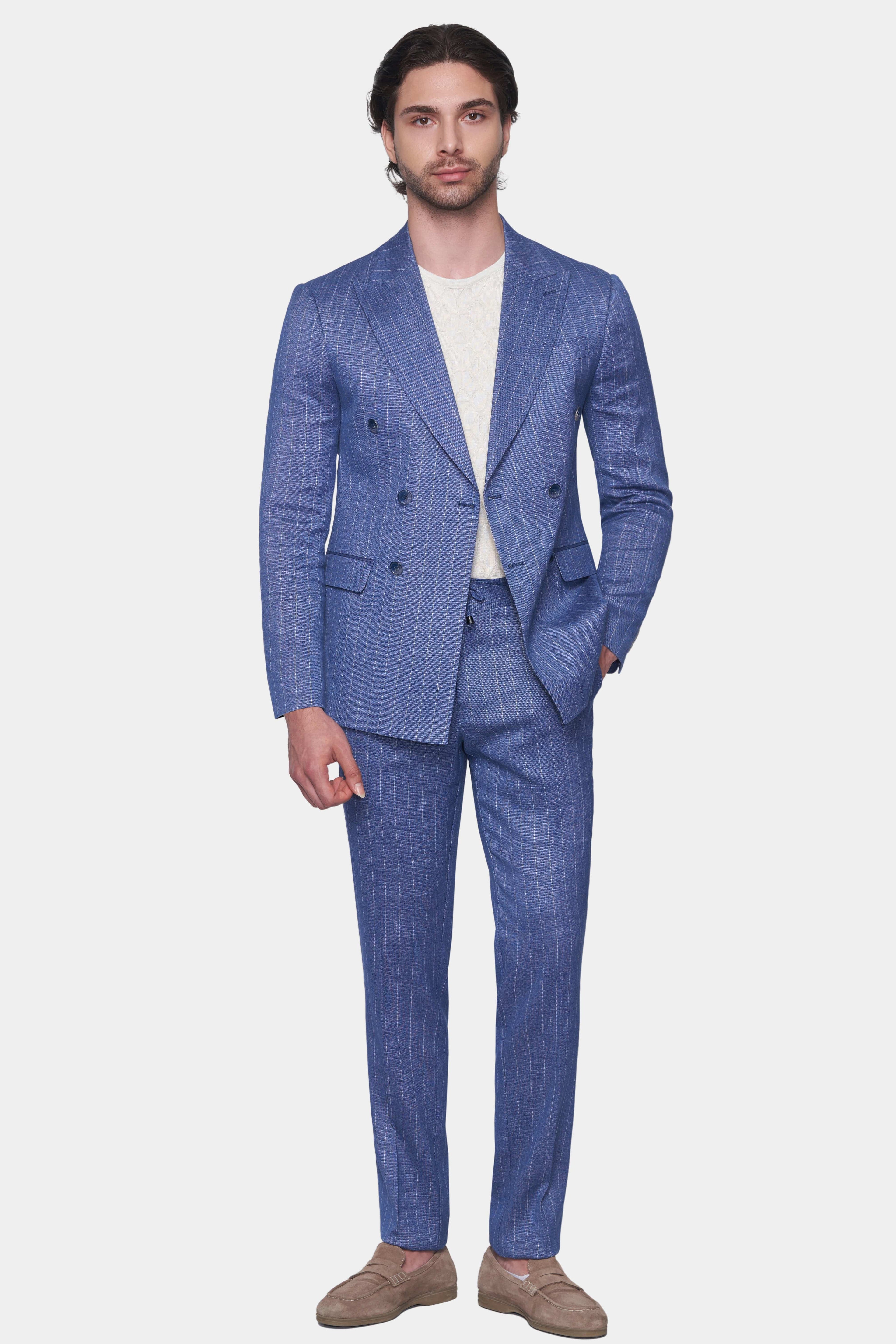 Man wearing a blue checkered suit on a white background