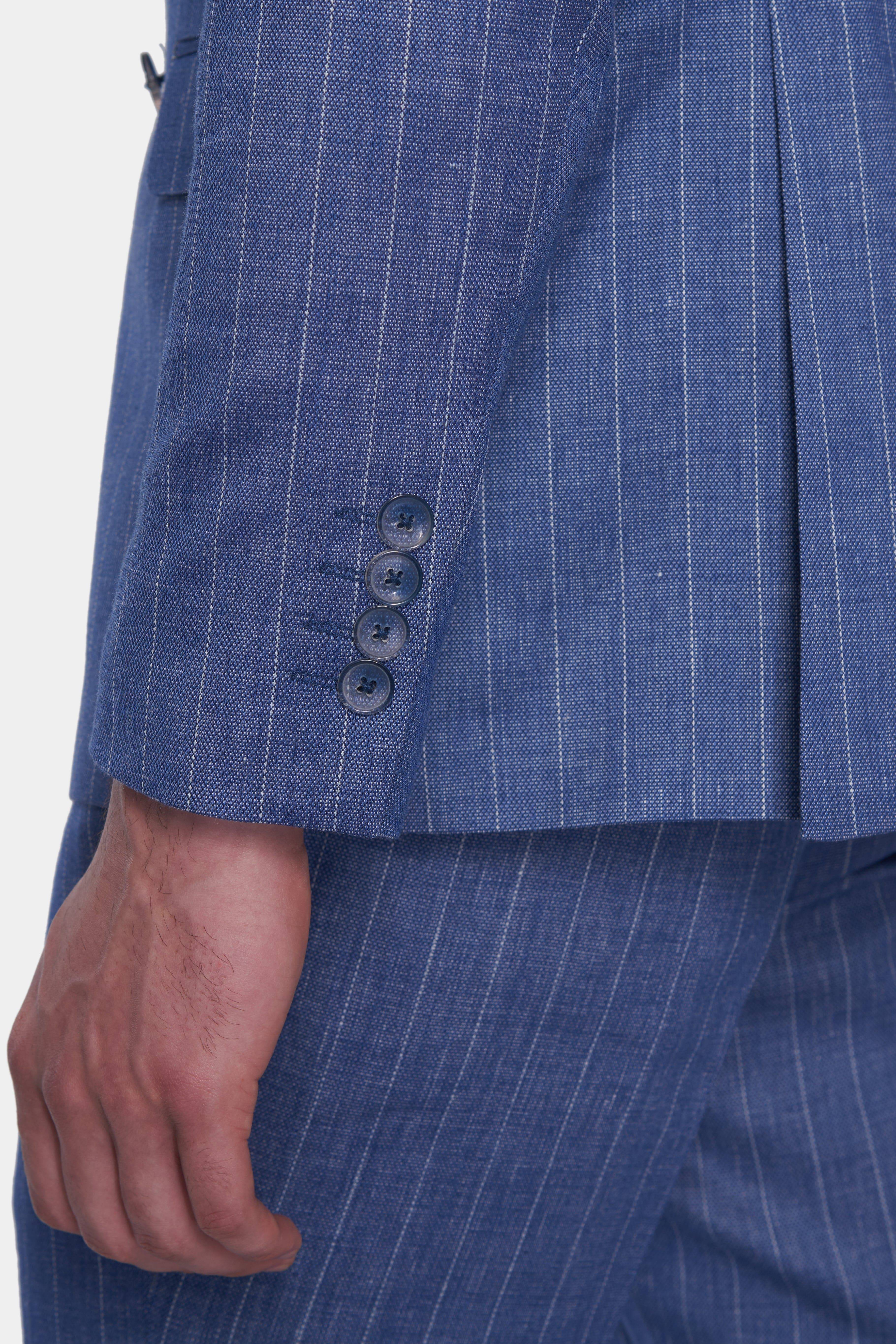 Close-up of a blue pinstripe suit with buttons on a white background