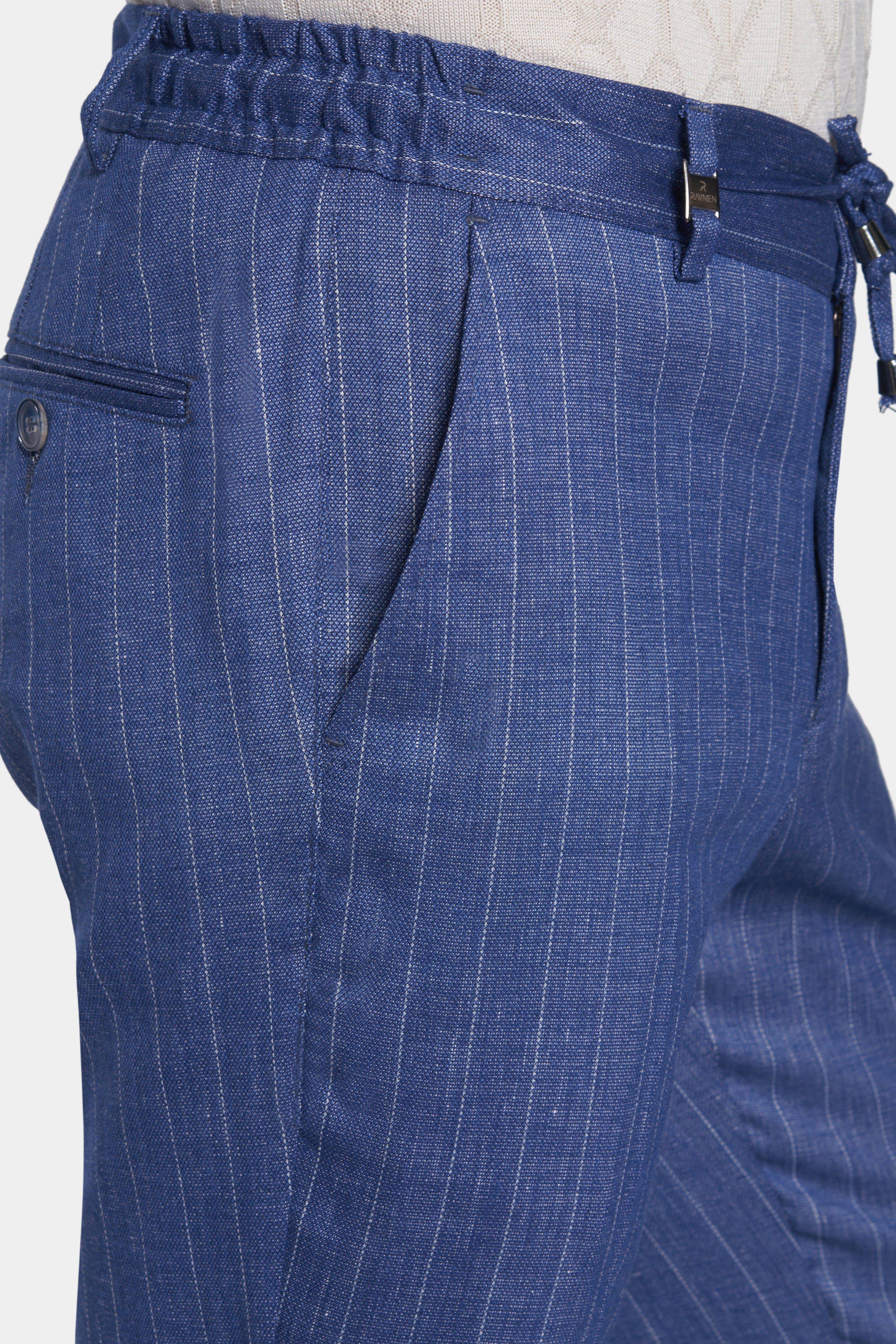 Close-up of blue pinstripe pants on a white background