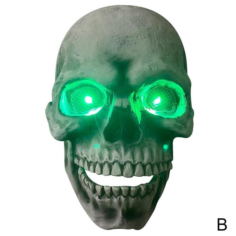 Skull mask with glowing green eyes on a white background