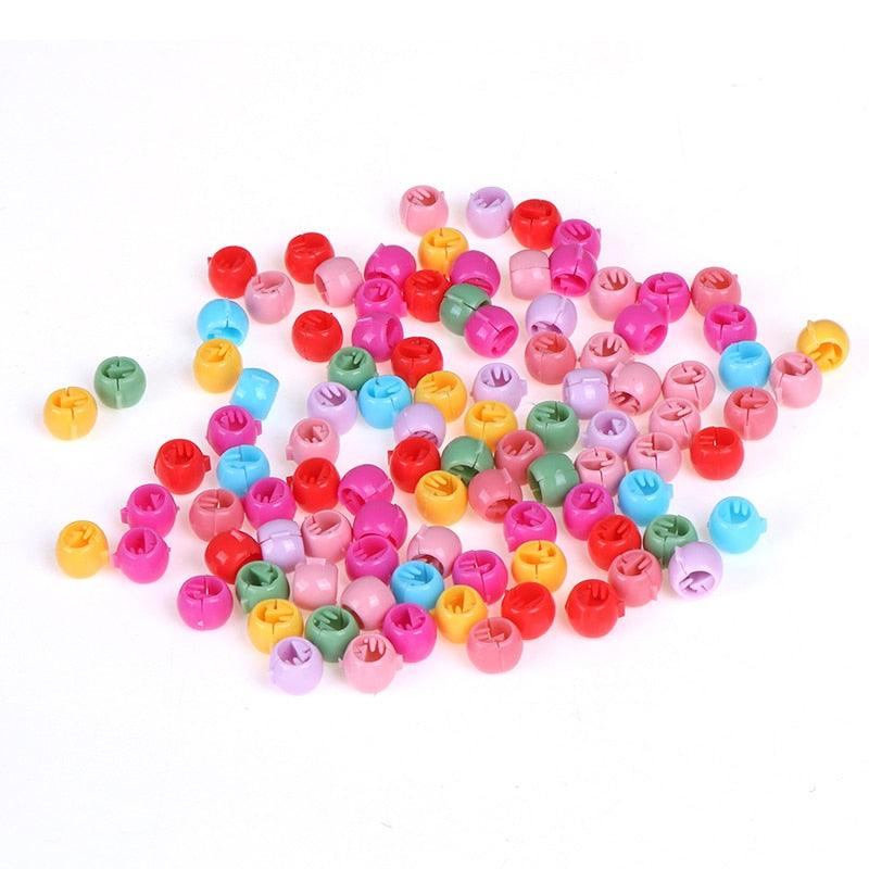 Colorful plastic beads on a white background