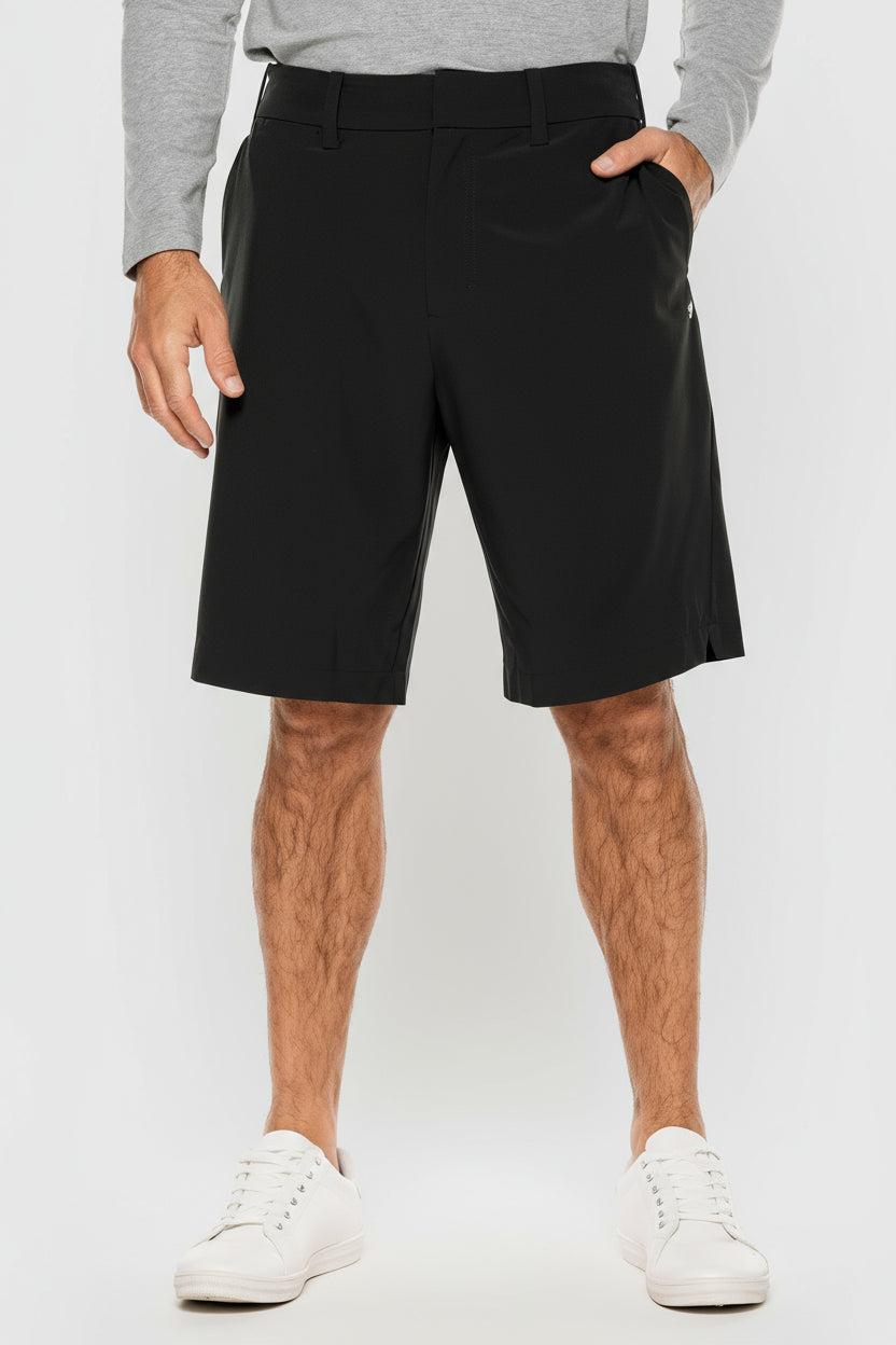 Person wearing black shorts on a white background