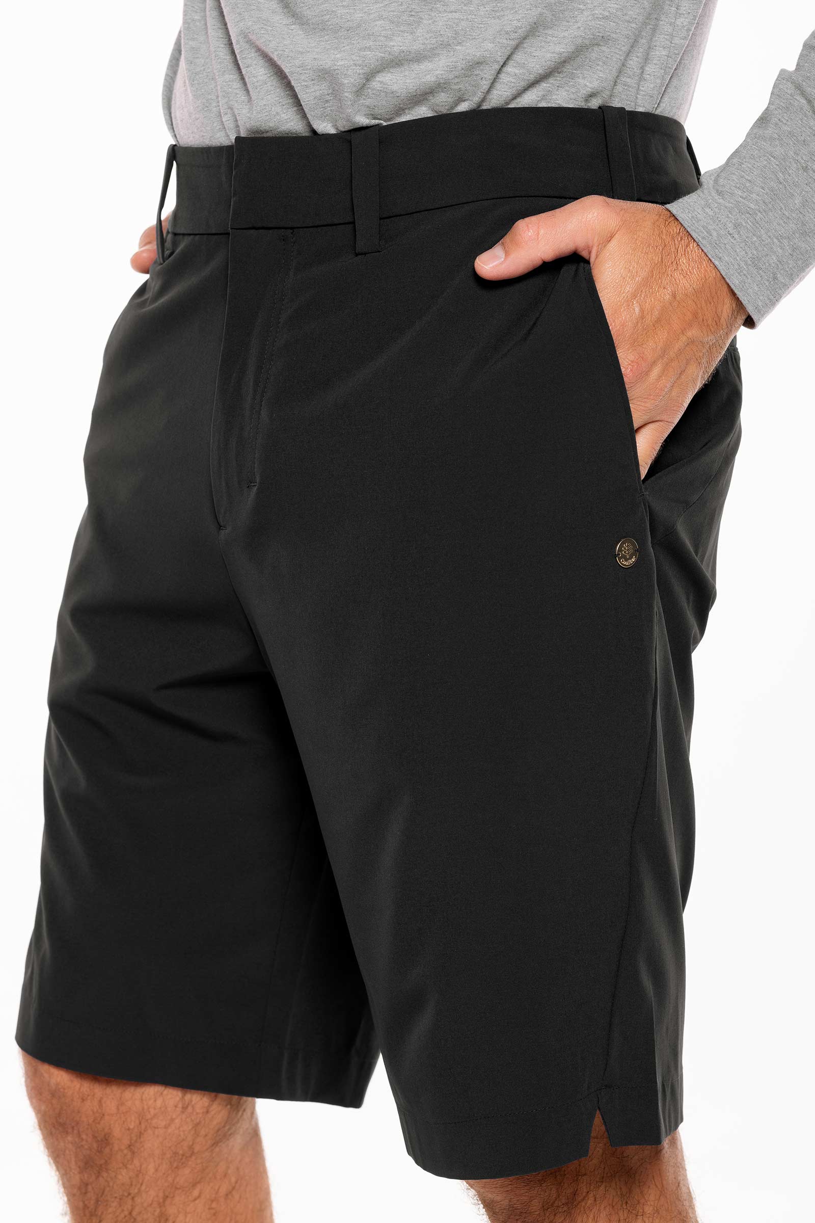 Black shorts worn by a person on a white background
