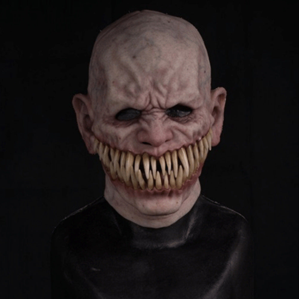Creepy mask with large teeth on a black background