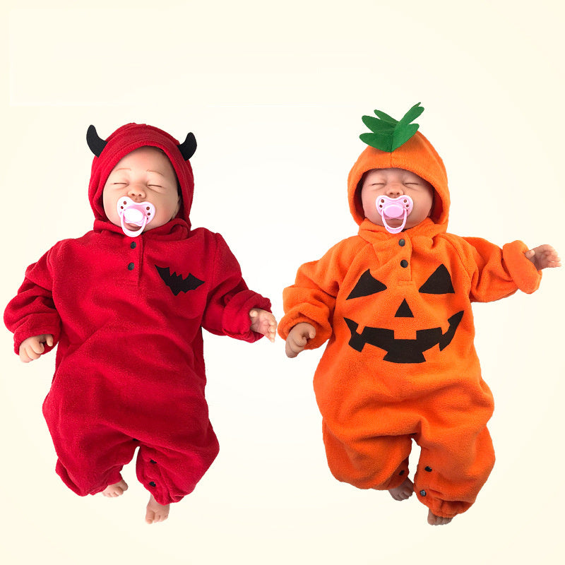Two babies in Halloween-themed outfits, one in a red devil costume and the other in an orange pumpkin costume, on a light beige background.