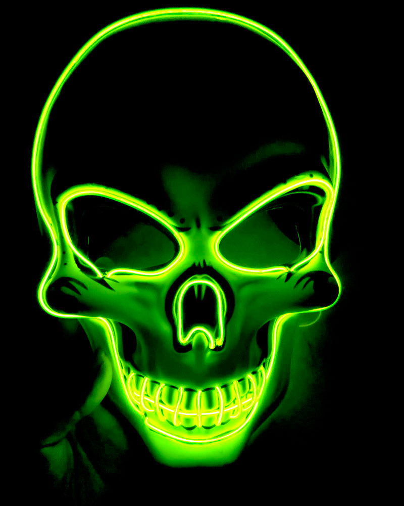 Green skull mask with glowing neon lines on a black background