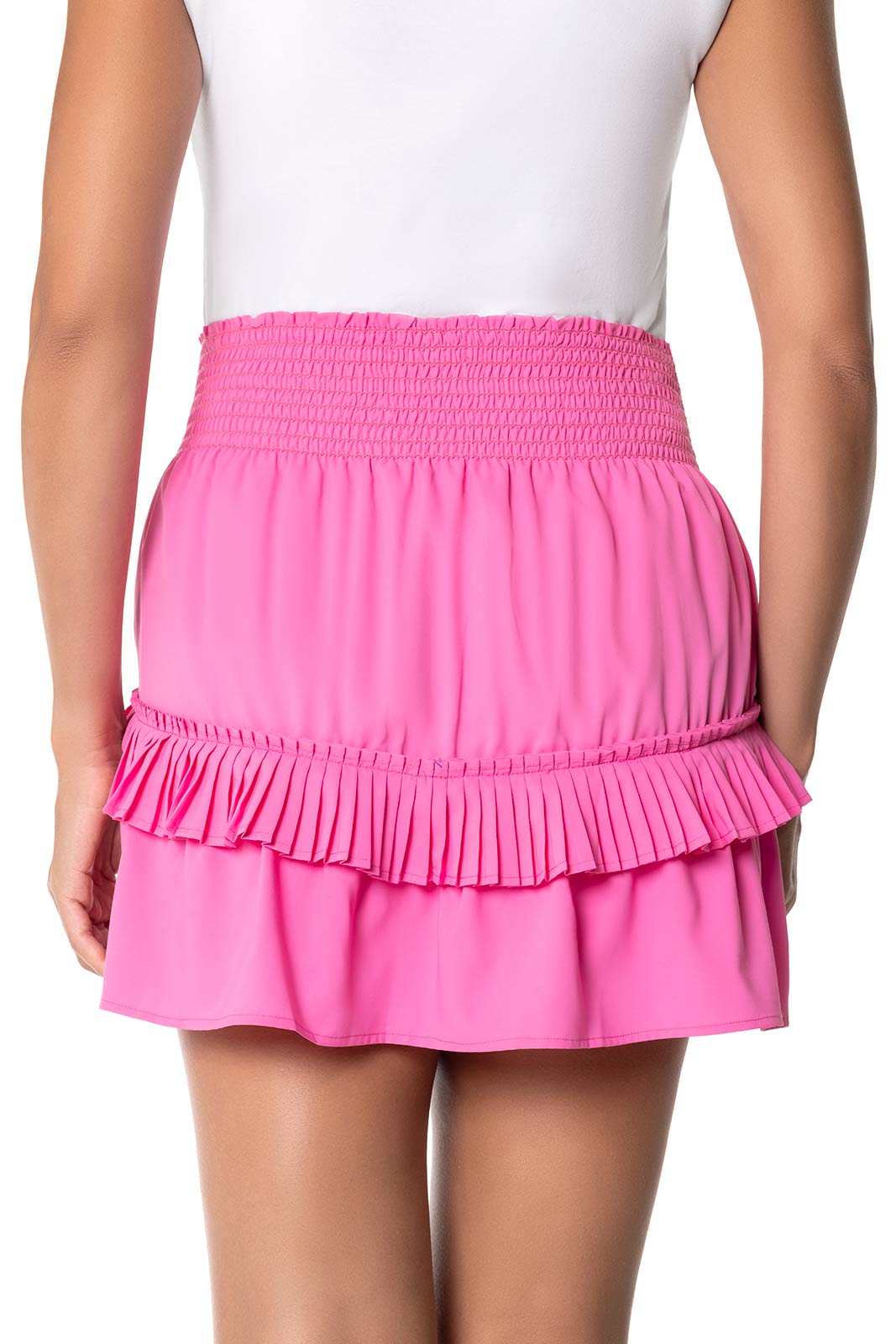 Pink ruffled skirt worn by a person on a white background
