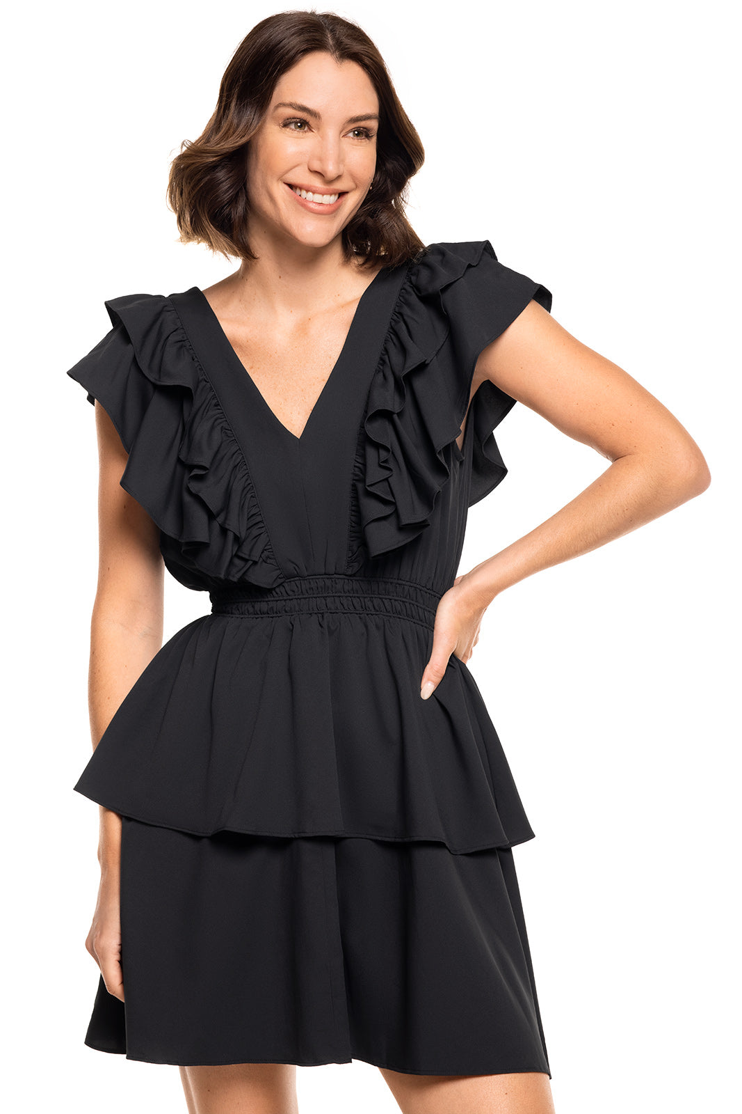 Woman wearing a black ruffled dress on a white background