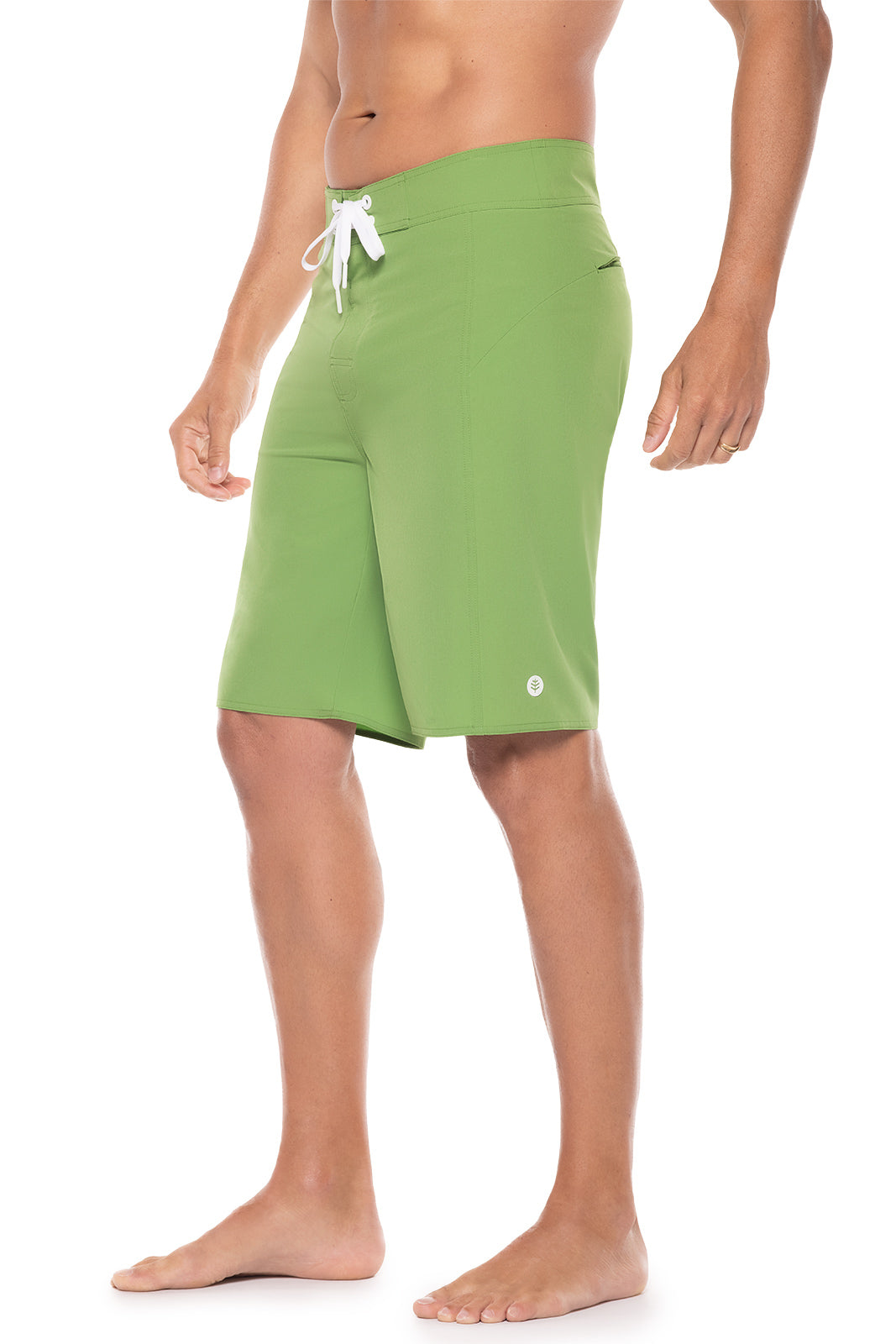Person wearing green shorts on a white background
