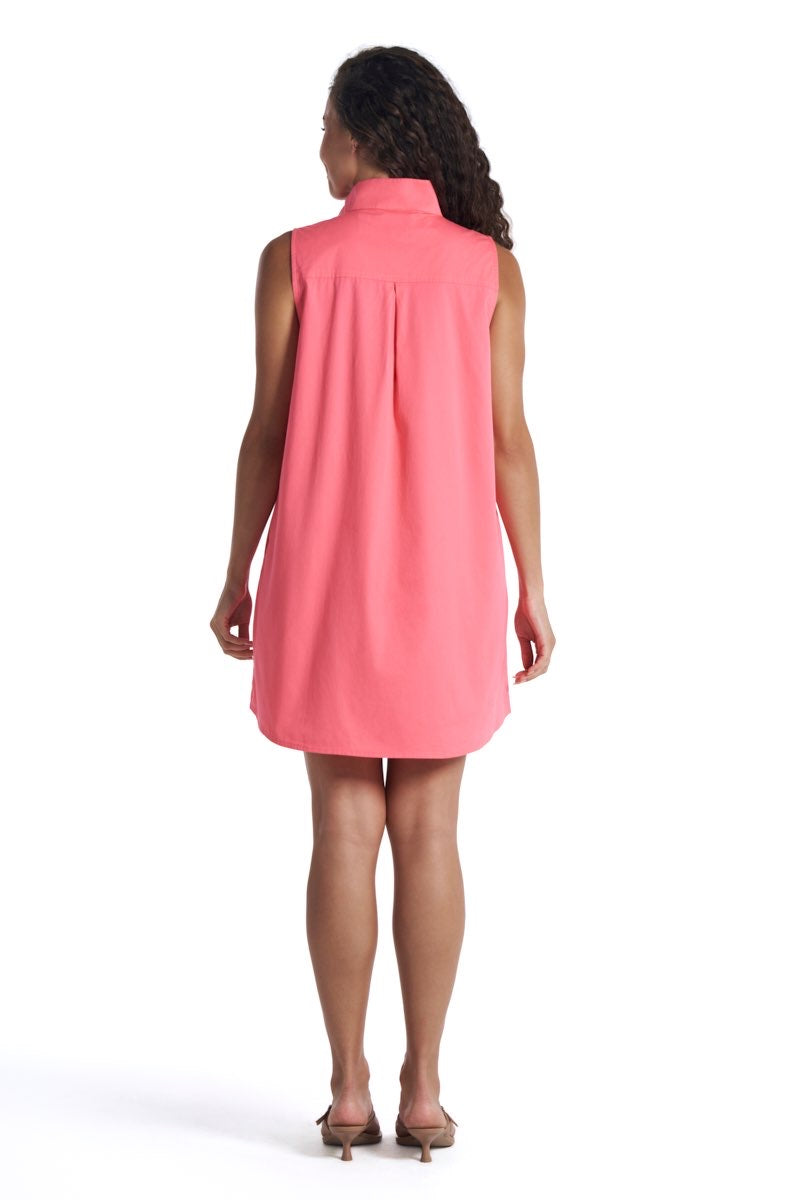Woman wearing a pink sleeveless dress on a white background