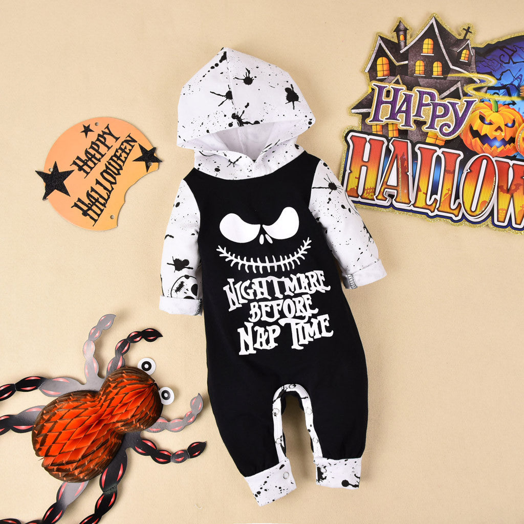 Halloween-themed baby romper with skull design and text on a beige background