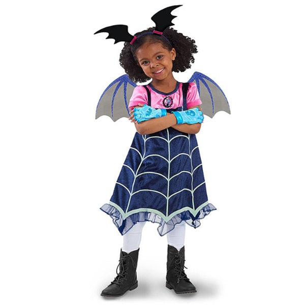 Child wearing a bat-themed costume with wings and a dress on a white background