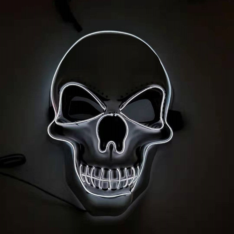 Skull mask with neon lighting on a dark background