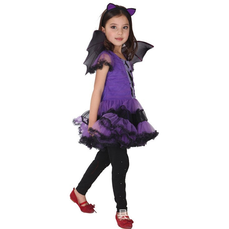 Child wearing a purple and black Halloween costume with bat wings on a white background