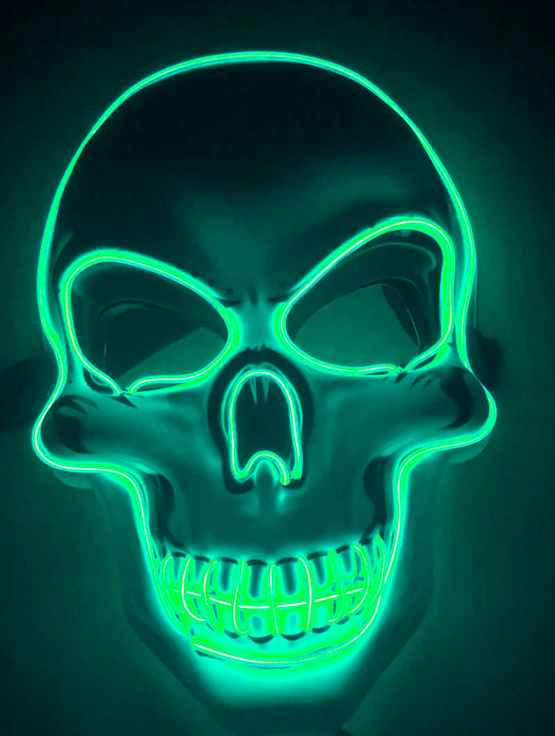 Green LED skull mask on a dark background