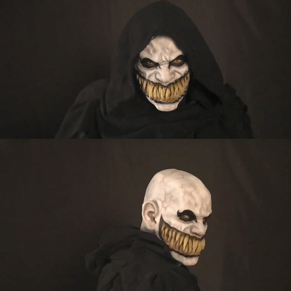 Two views of a character in a dark hood with a menacing face mask on a black background.