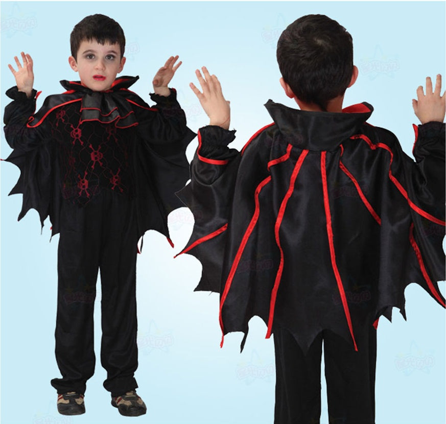 Child wearing a black and red Halloween costume with wings on a light blue background