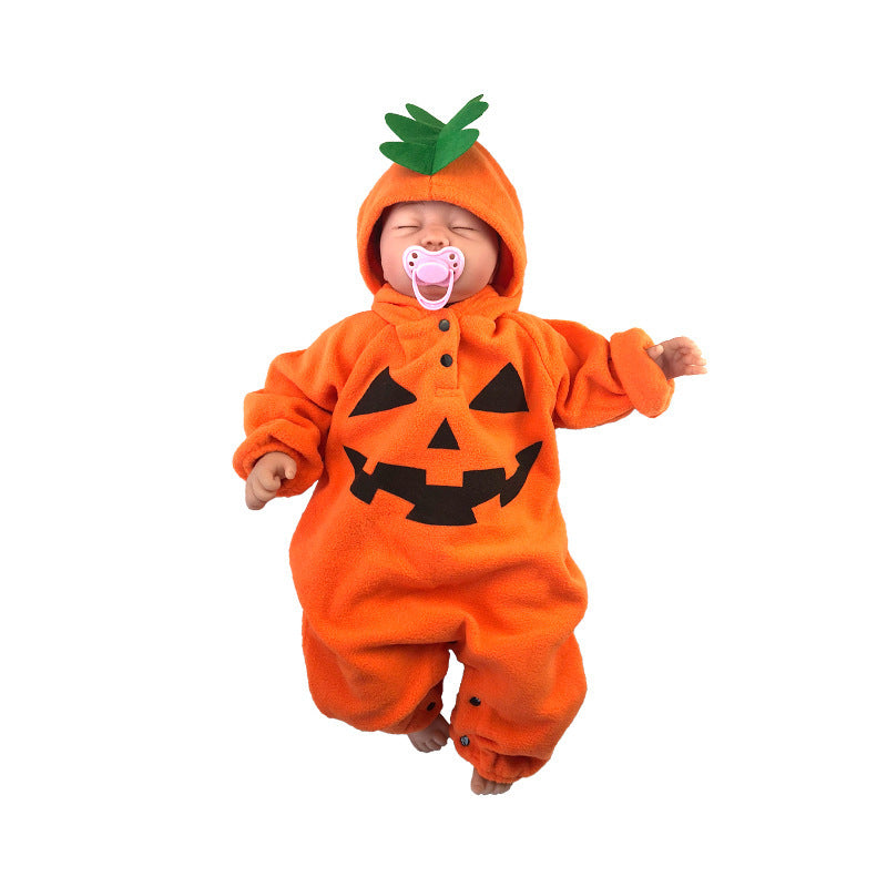 Baby in a pumpkin costume with a white background
