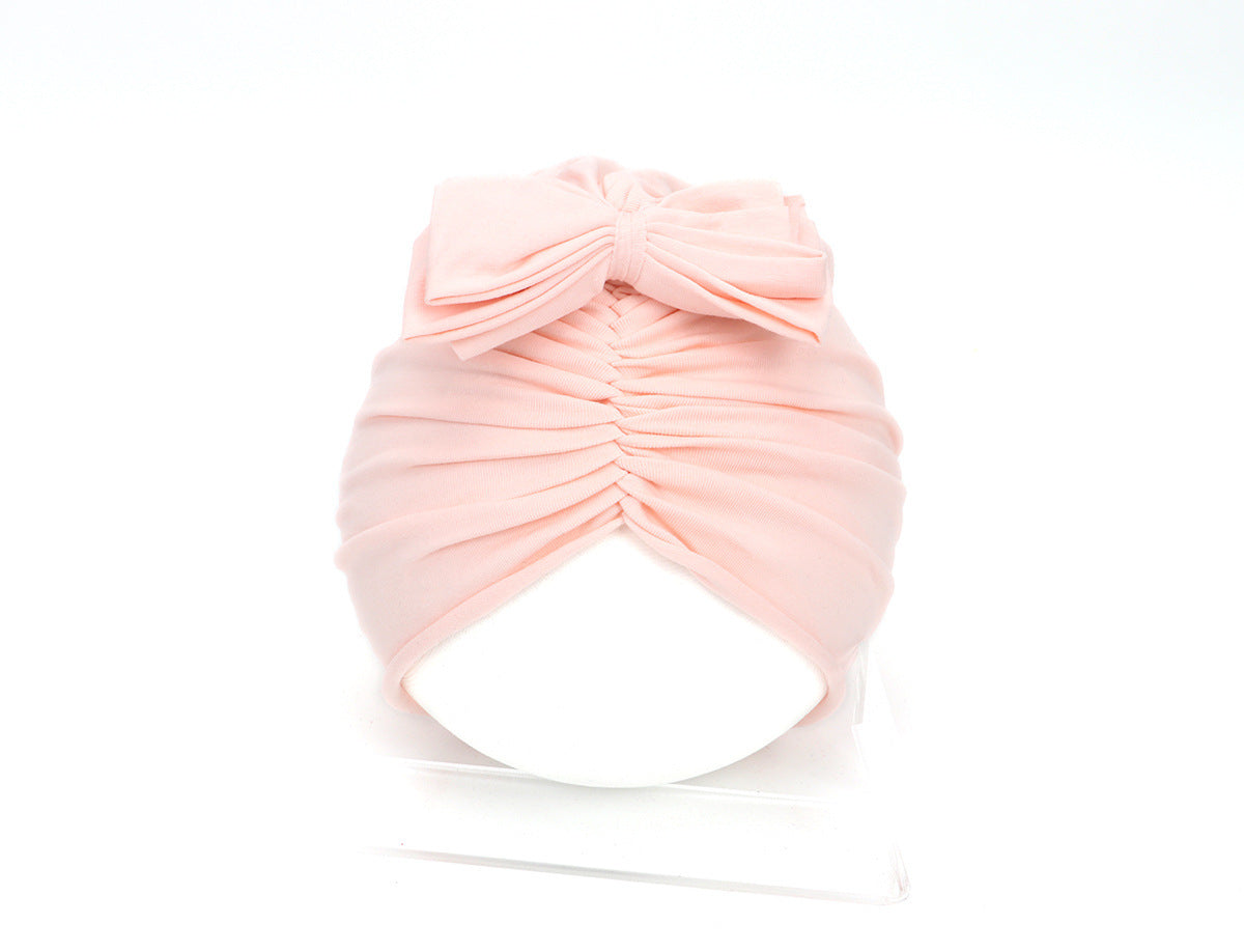 Pink turban on a white background