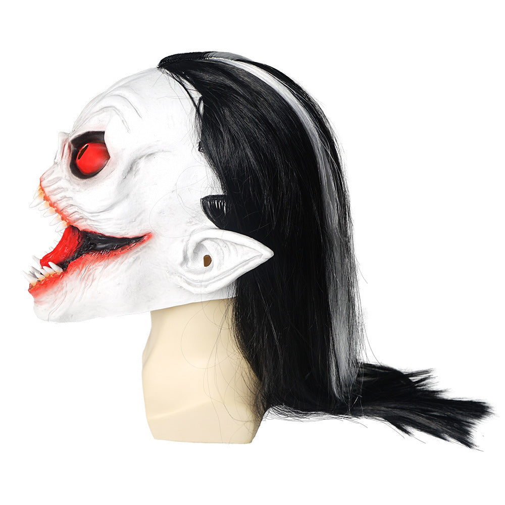 Halloween mask with black hair on a mannequin head against a white background