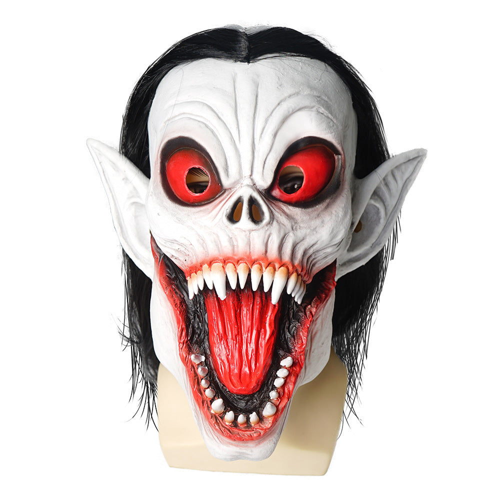 Halloween mask with red eyes and open mouth on a white background