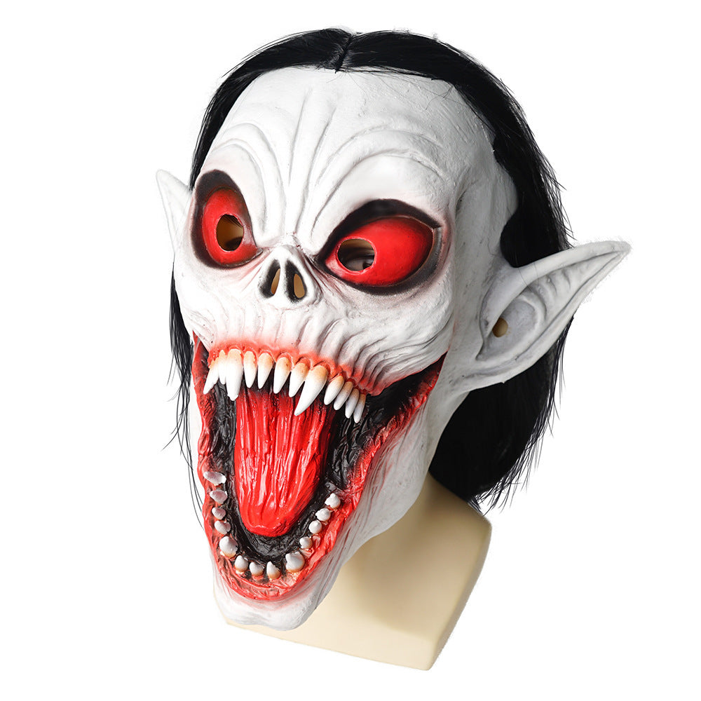 Halloween mask with red eyes and fangs on a white background