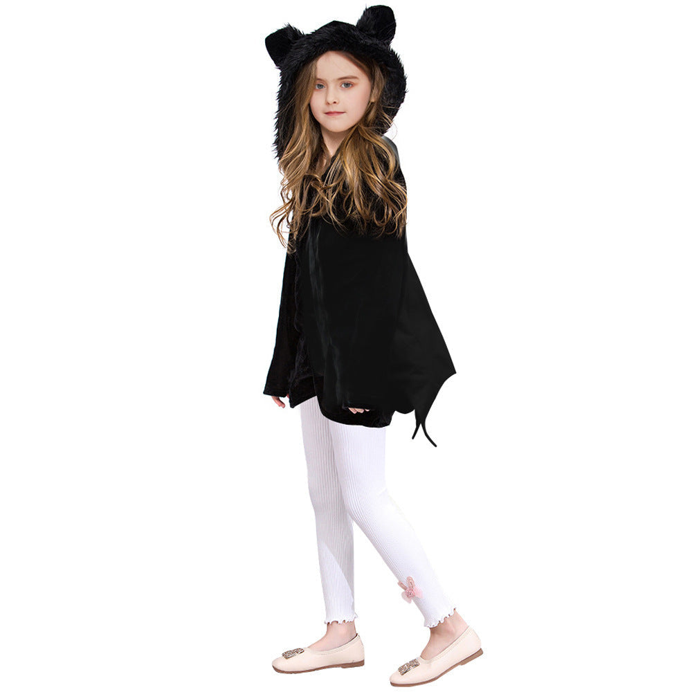 Child wearing a black hoodie with bear ears on a white background