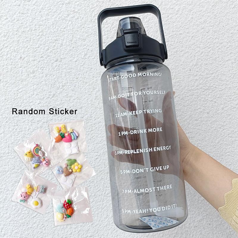 Gray water bottle with motivational text and a hand holding a small bag of colorful stickers on a light gray background.
