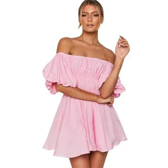 Woman wearing a pink off-shoulder dress on a white background