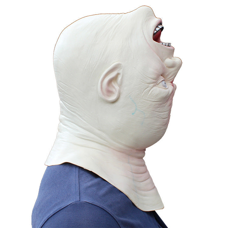 Person wearing a shark-like mask on a white background