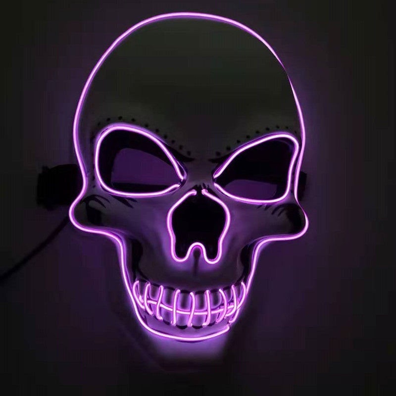 Neon purple skull mask on a dark background