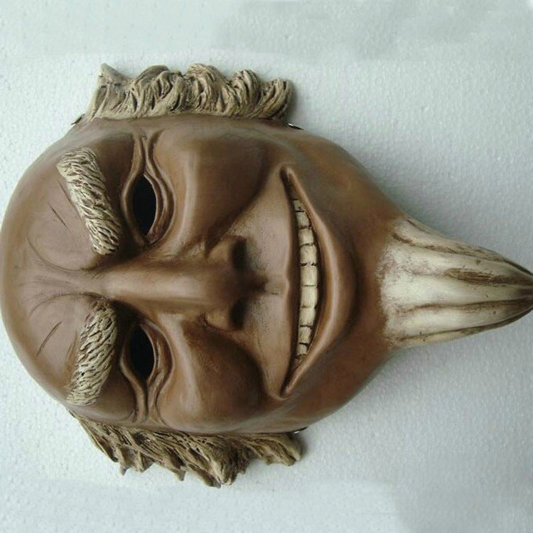 Brown mask with detailed facial features on a white background