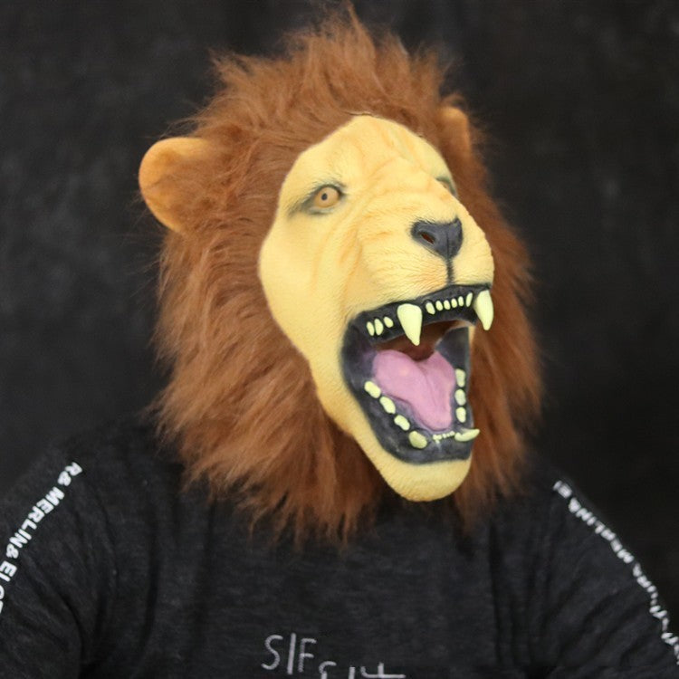 Person wearing a lion mask with an open mouth on a dark background