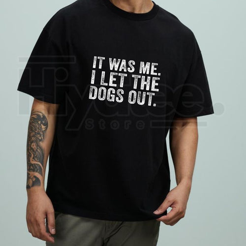Person wearing a black t-shirt with humorous text design on a plain background