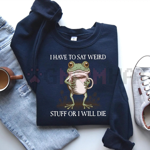 Navy blue sweatshirt with a frog graphic and text on a white surface with jeans and shoes.