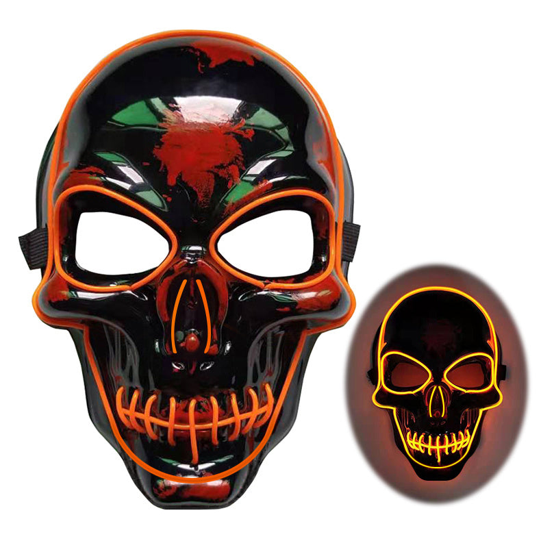 Skull mask with orange accents and glowing effect on a white background