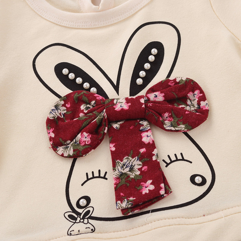 Floral bow on a white background with black outline of a face.