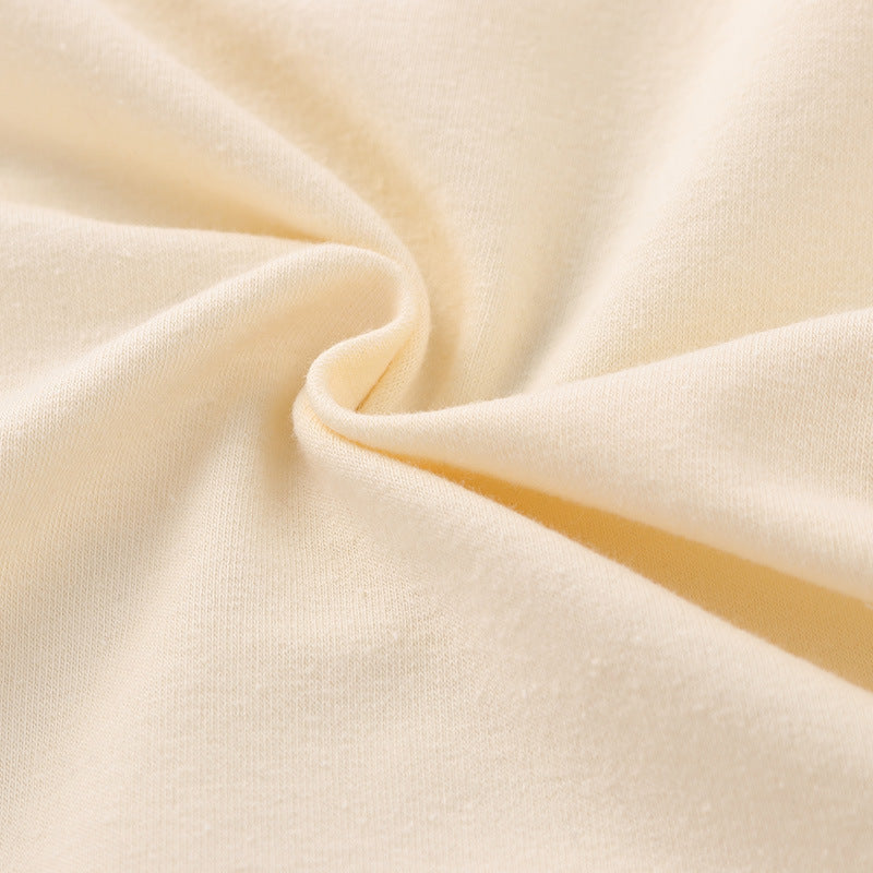 Close-up of beige fabric with folds