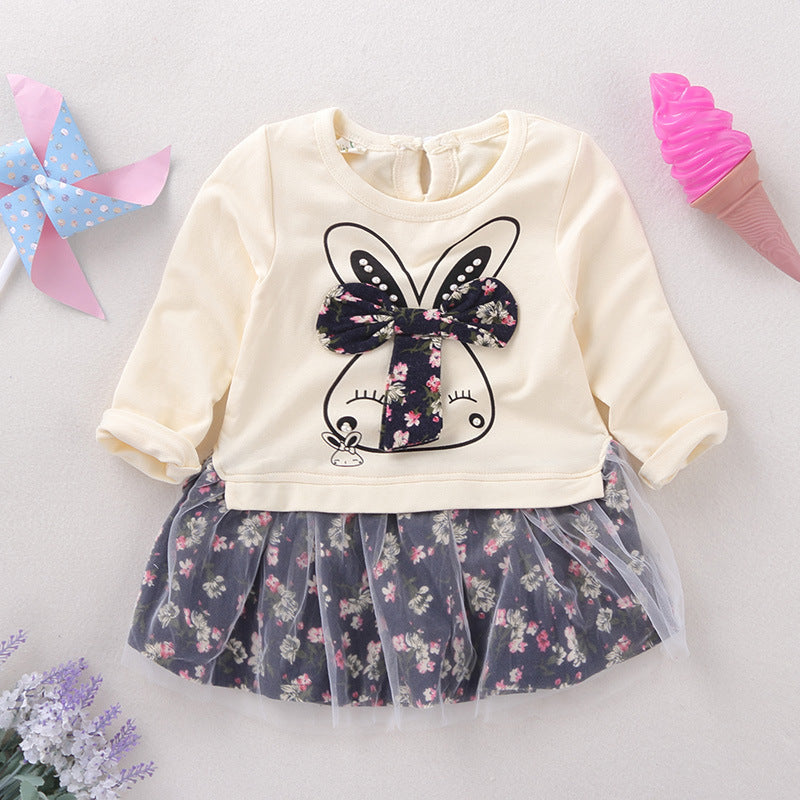 Children's outfit with a white top and floral skirt on a light background
