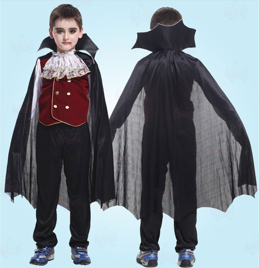 Child wearing a vampire costume with a black cape and red vest on a light blue background