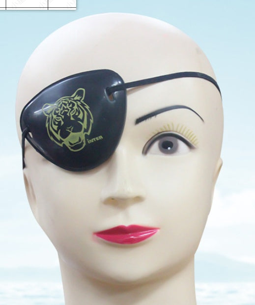 Mannequin head with a black eye patch featuring a tiger design on a light blue background