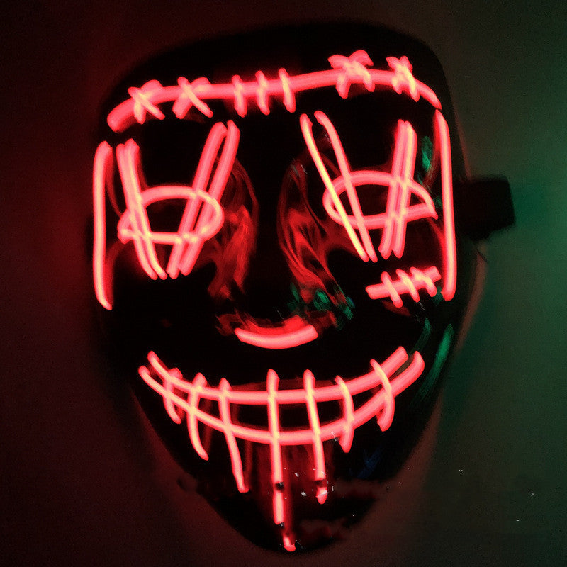 Neon pink mask with a dark background