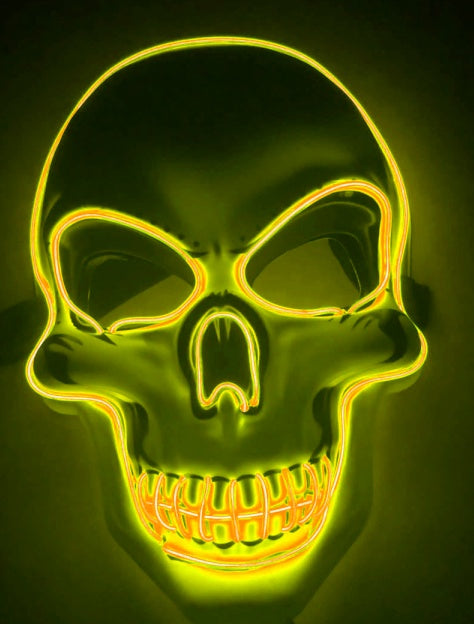 Neon yellow skull mask on a dark background