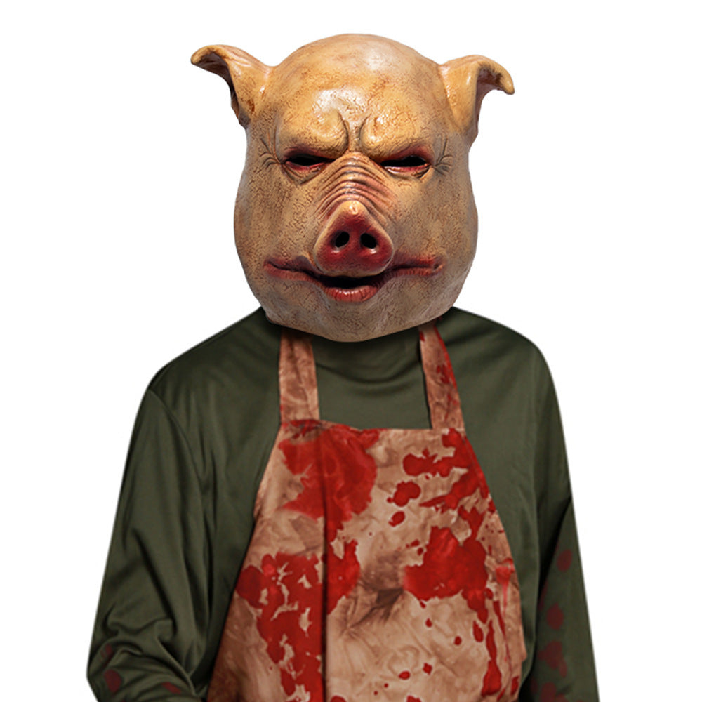 Person wearing a pig mask and apron on a white background