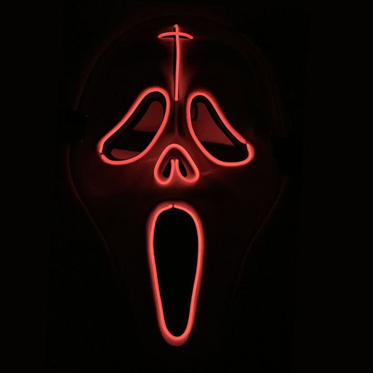Neon red mask with a cross on a black background