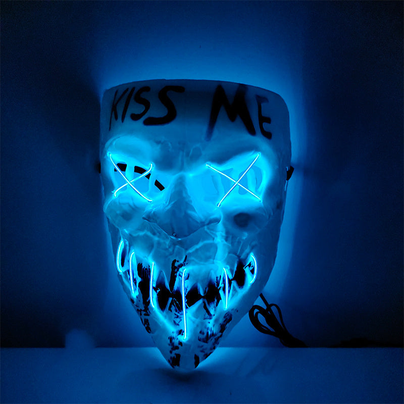 Mask with blue LED lights and 'Kiss Me' text on a dark background
