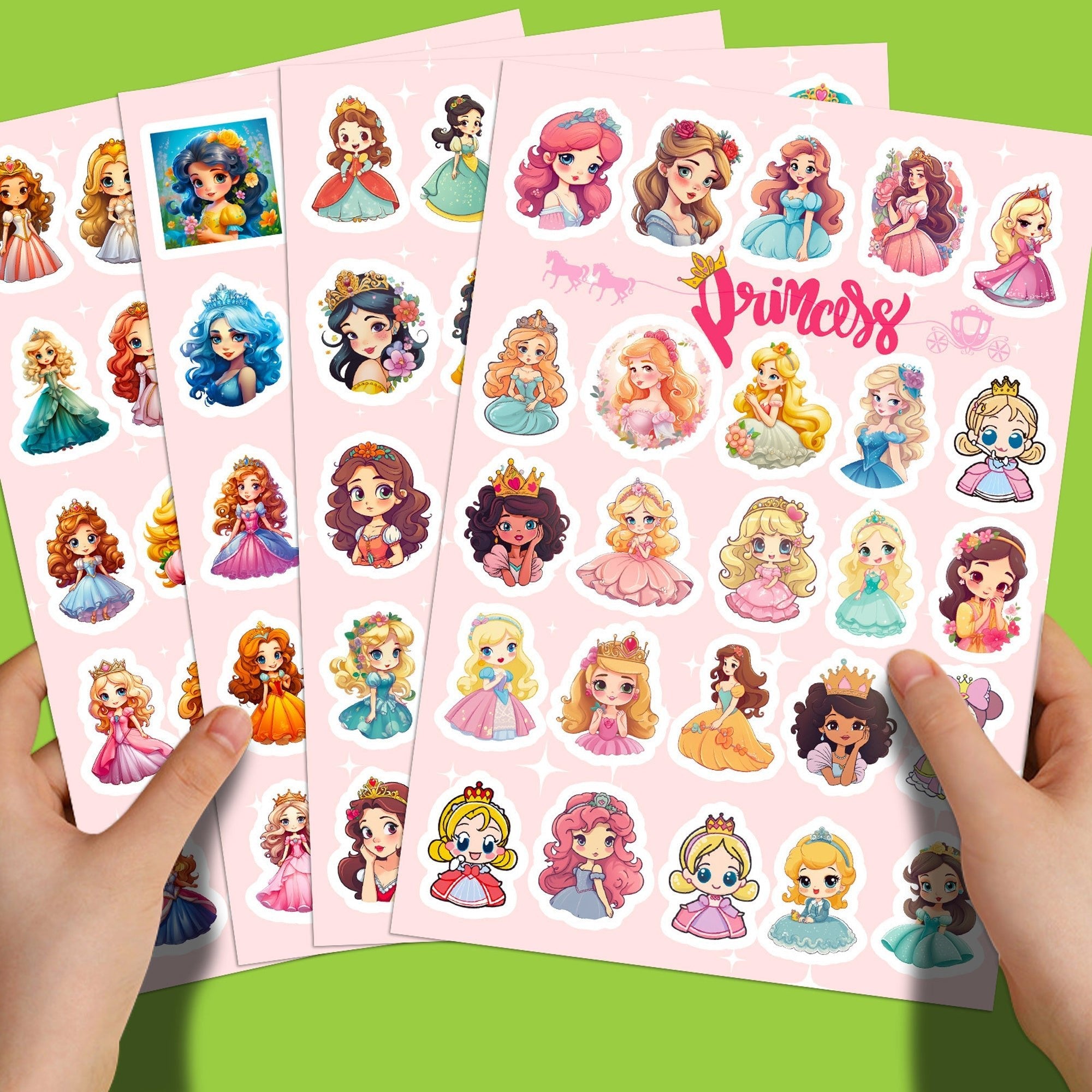 Sheets of princess stickers held by hands on a green background