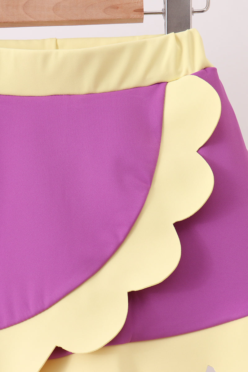 Purple and yellow skirt with scalloped edge on a white background
