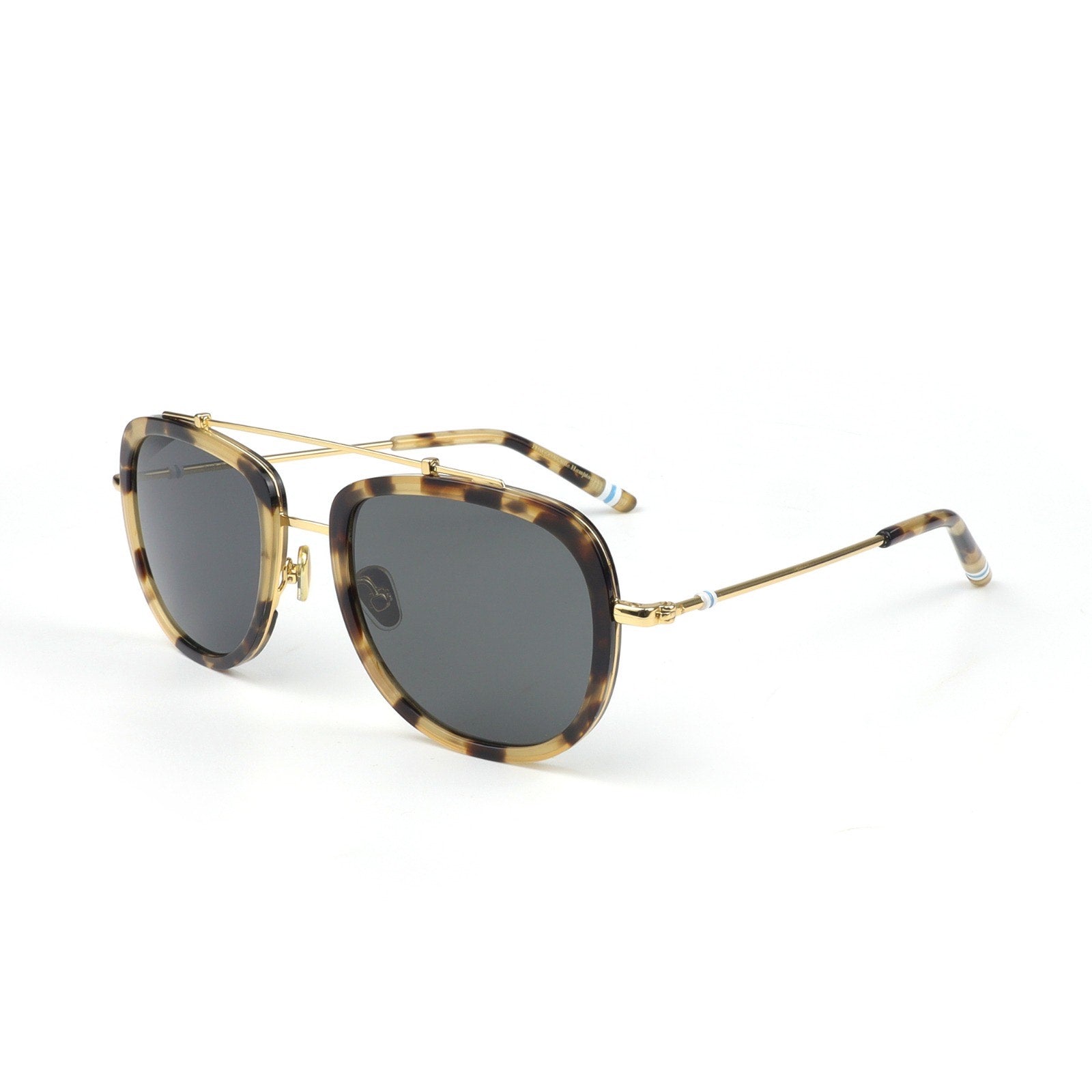 Sunglasses with tortoiseshell frame and dark lenses on a white background
