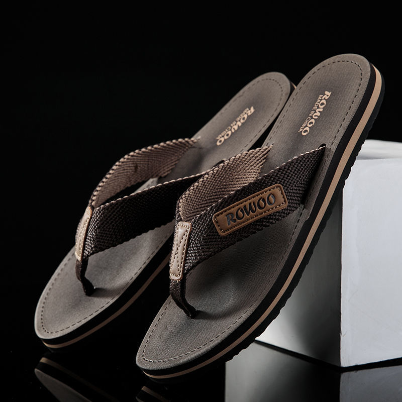 Brown sandals with 'ROWOO' branding on a black background